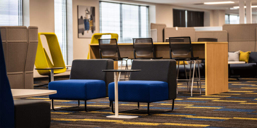 large open office space bright colored furniture