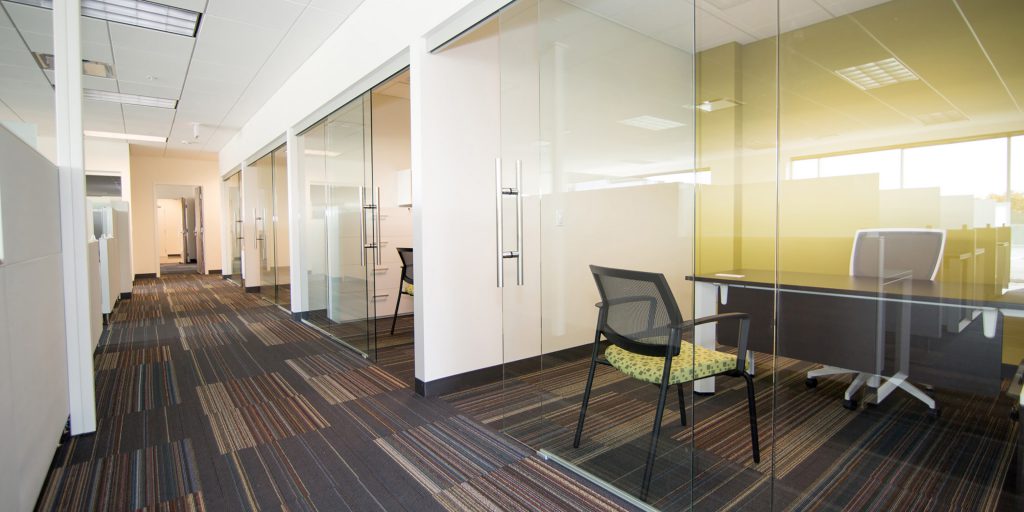 private workspaces with sliding glass doors