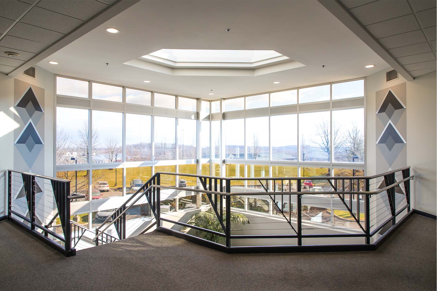 Stealth technology center interior multi-level lobby with large windows
